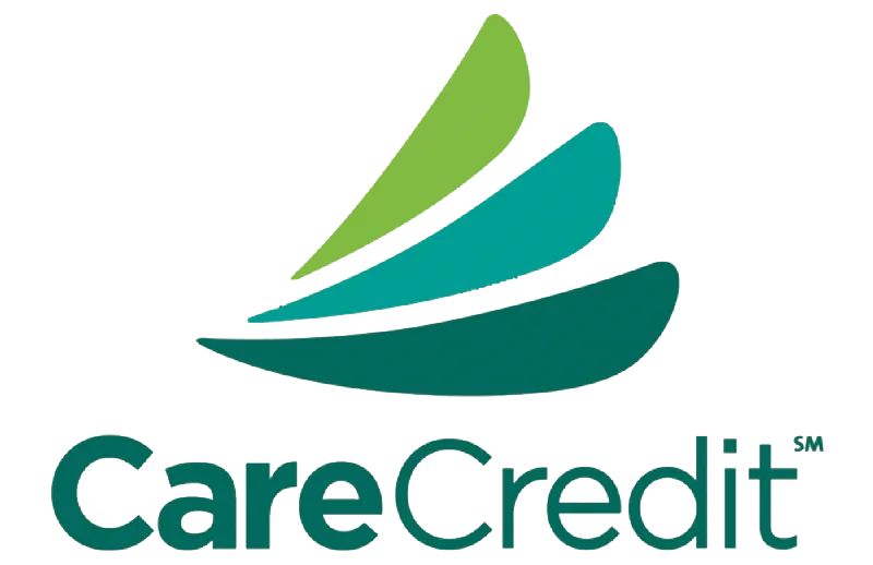 A CareCredit card being used to pay for dental treatment at Pinellas Dental Specialties